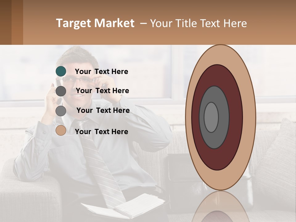 A Man Sitting On A Couch Talking On A Cell Phone PowerPoint Template