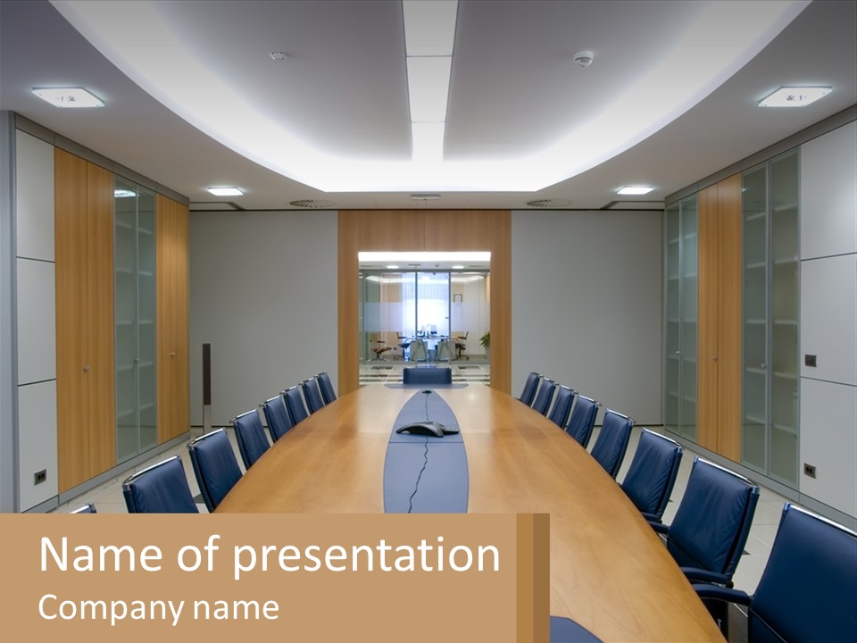 A Conference Room With A Long Table And Blue Chairs PowerPoint Template