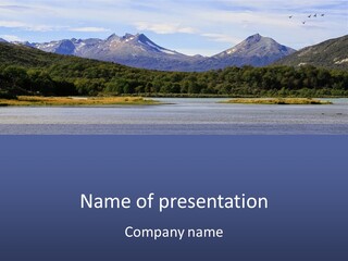 A Lake With Mountains In The Background And A Blue Sky PowerPoint Template