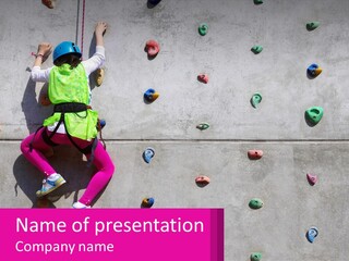 A Woman Climbing Up The Side Of A Rock Wall PowerPoint Template