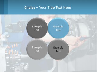 A Man Working On A Machine In A Factory PowerPoint Template
