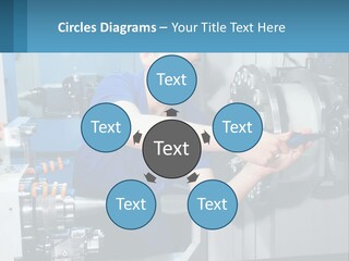 A Man Working On A Machine In A Factory PowerPoint Template