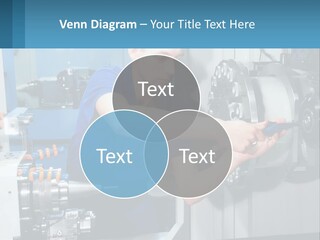 A Man Working On A Machine In A Factory PowerPoint Template