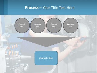 A Man Working On A Machine In A Factory PowerPoint Template