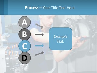 A Man Working On A Machine In A Factory PowerPoint Template