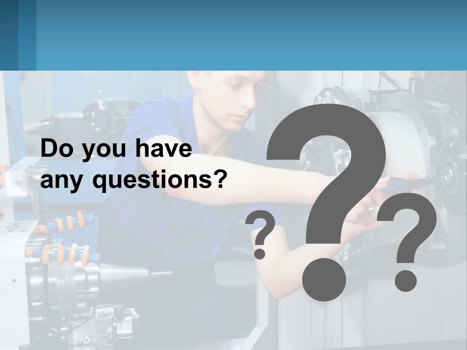 A Man Working On A Machine In A Factory PowerPoint Template