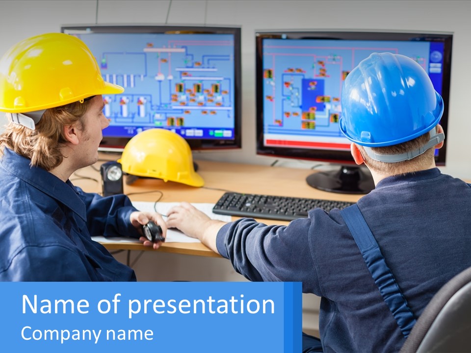 A Man In A Hard Hat Is Working On A Computer PowerPoint Template