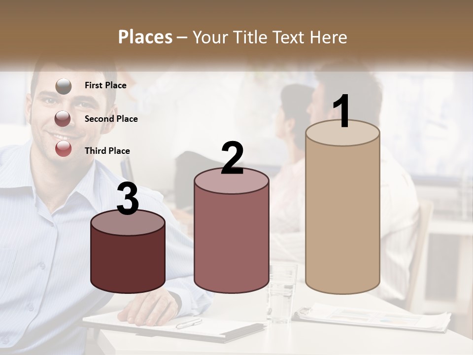 A Man Sitting At A Desk In Front Of A Group Of People PowerPoint Template
