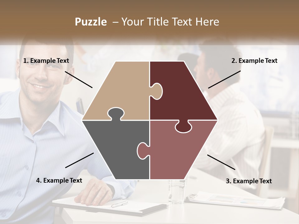 A Man Sitting At A Desk In Front Of A Group Of People PowerPoint Template