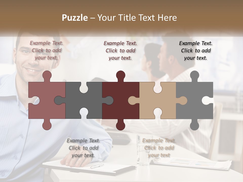 A Man Sitting At A Desk In Front Of A Group Of People PowerPoint Template