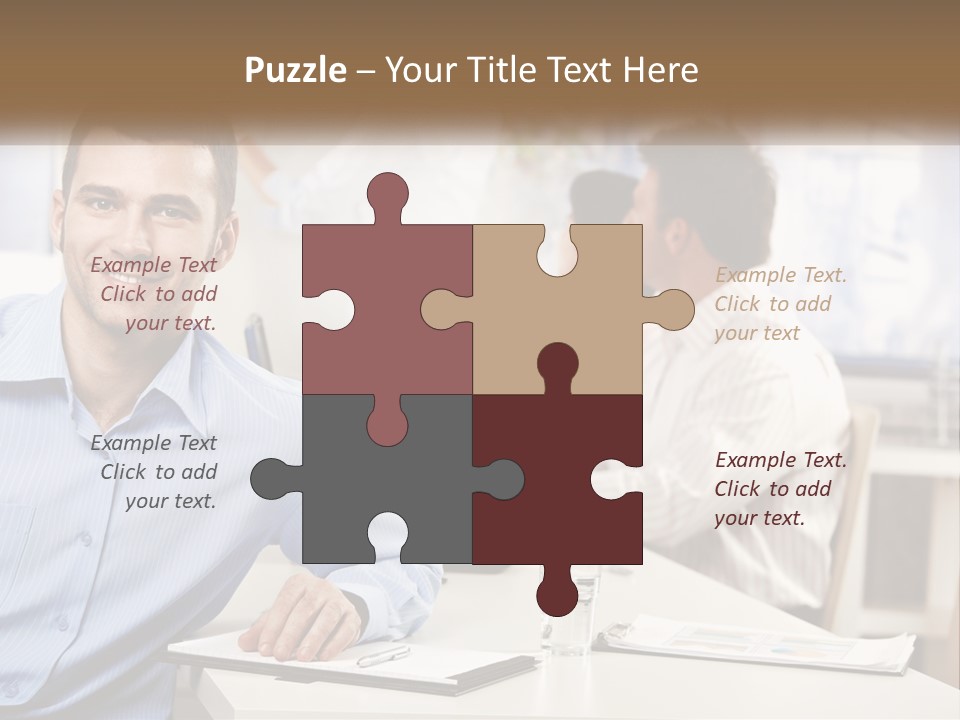 A Man Sitting At A Desk In Front Of A Group Of People PowerPoint Template