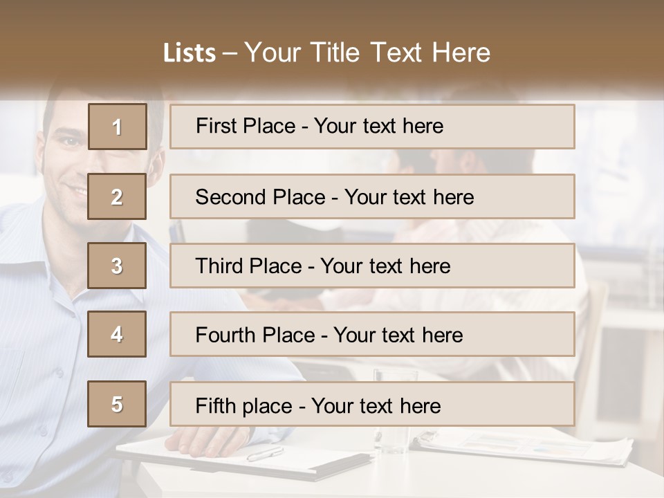A Man Sitting At A Desk In Front Of A Group Of People PowerPoint Template