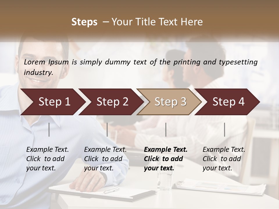 A Man Sitting At A Desk In Front Of A Group Of People PowerPoint Template