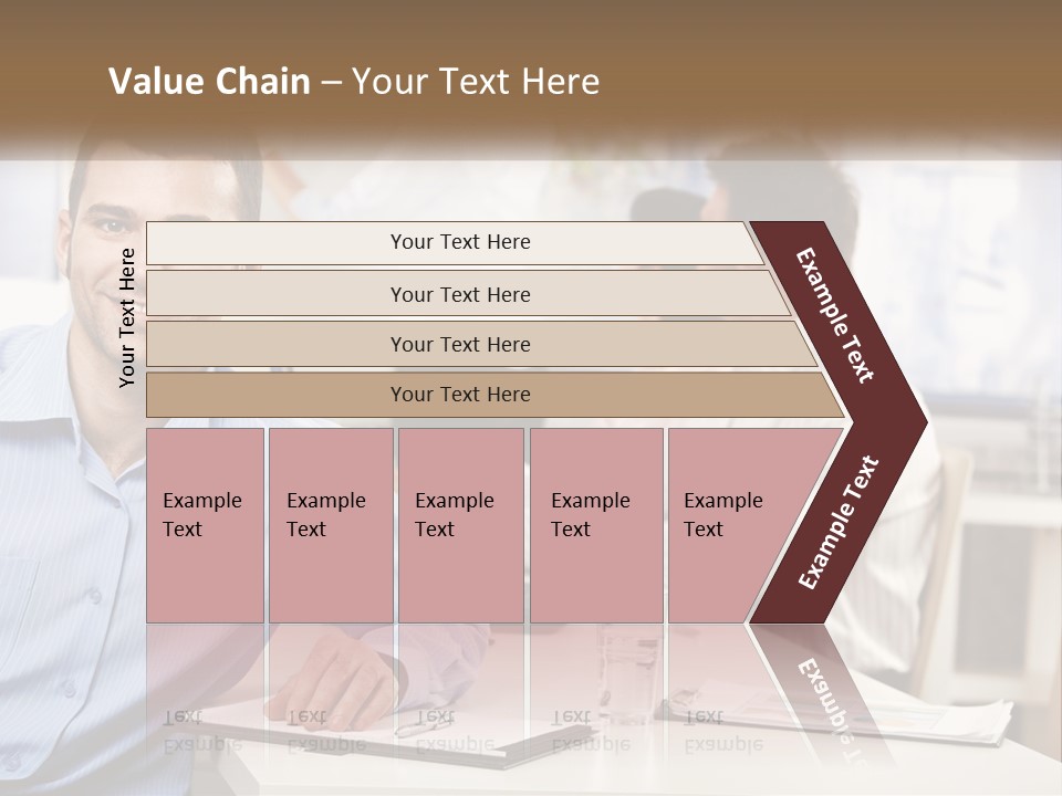 A Man Sitting At A Desk In Front Of A Group Of People PowerPoint Template