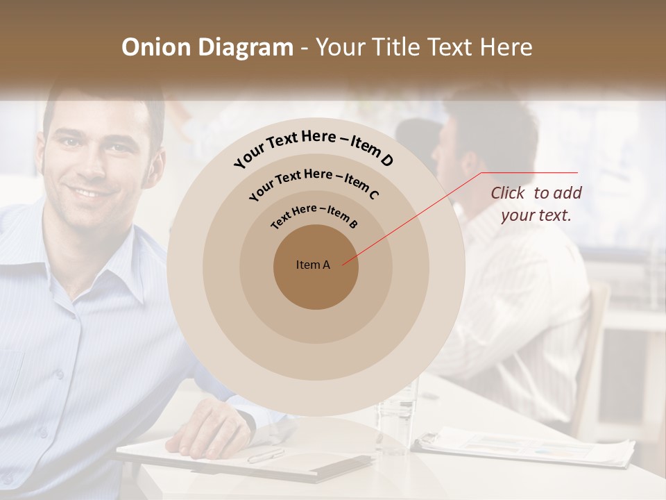 A Man Sitting At A Desk In Front Of A Group Of People PowerPoint Template