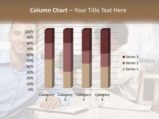 A Man Sitting At A Desk In Front Of A Group Of People PowerPoint Template