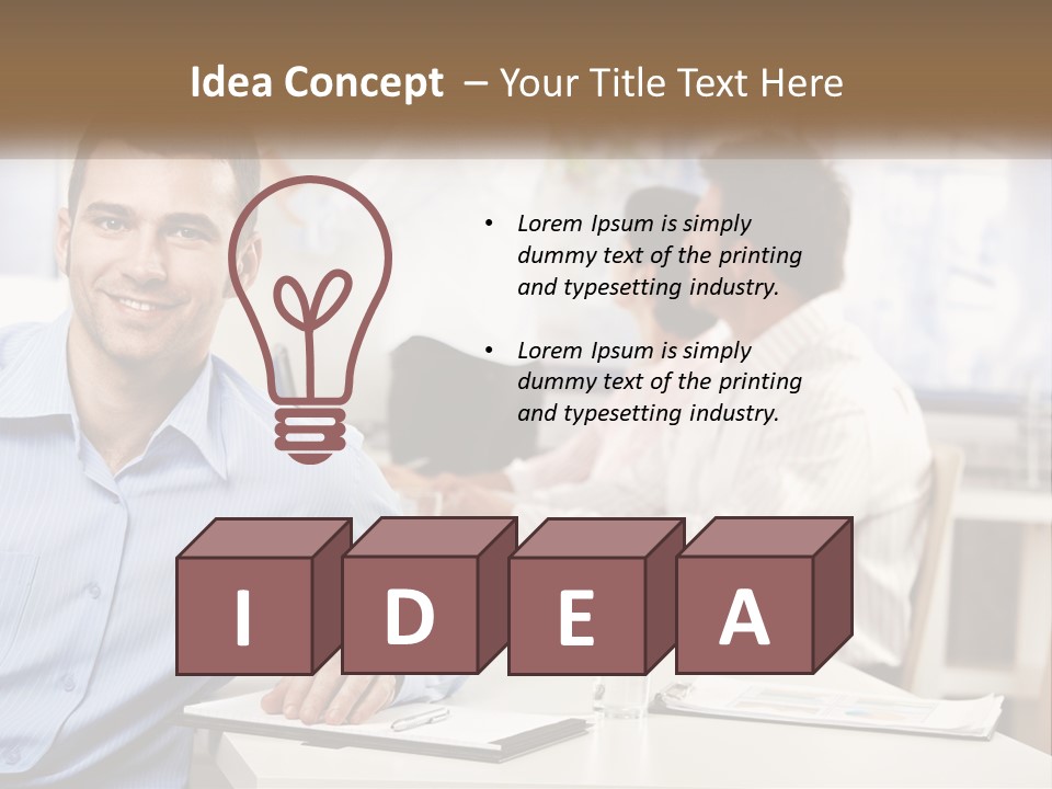 A Man Sitting At A Desk In Front Of A Group Of People PowerPoint Template