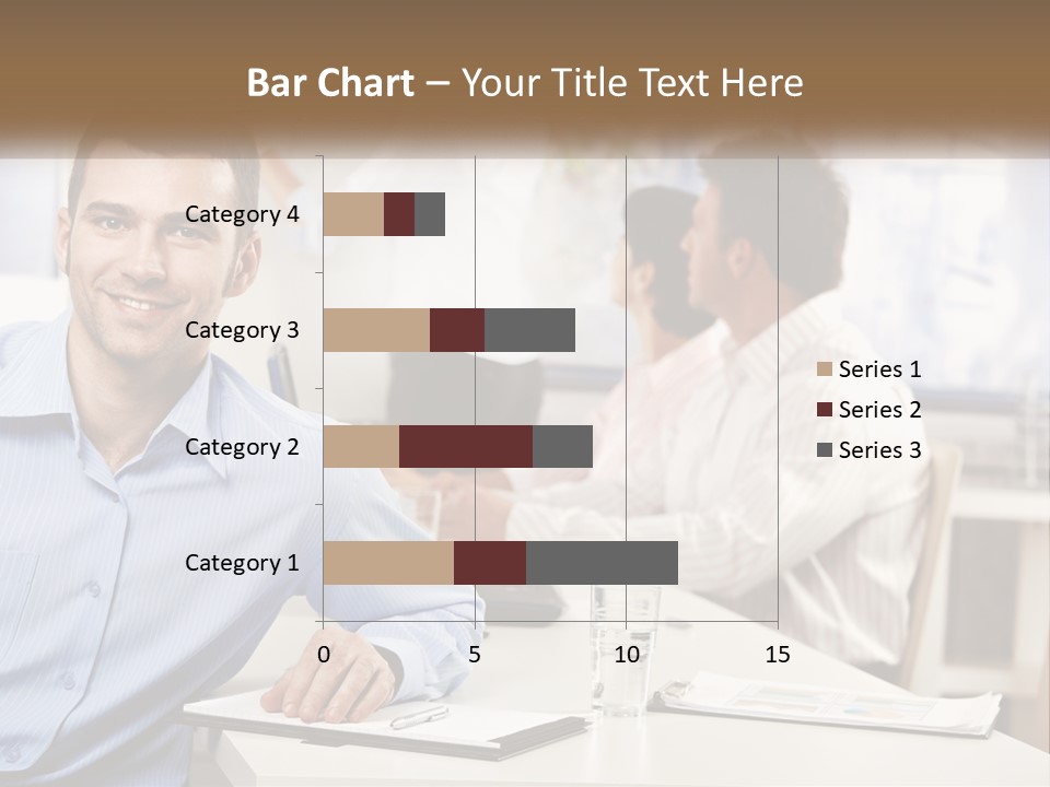 A Man Sitting At A Desk In Front Of A Group Of People PowerPoint Template