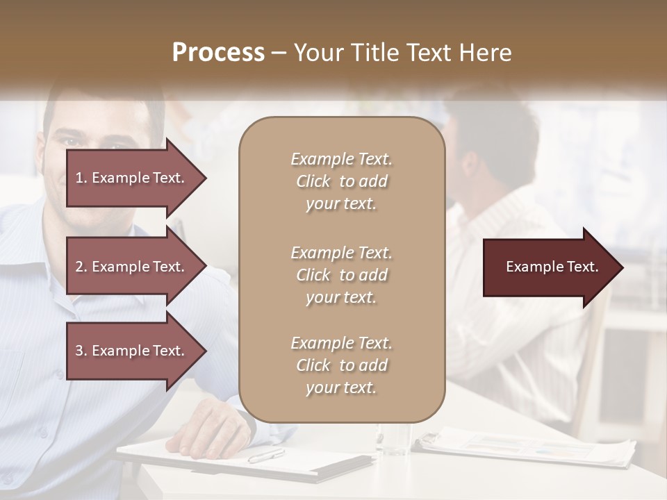 A Man Sitting At A Desk In Front Of A Group Of People PowerPoint Template