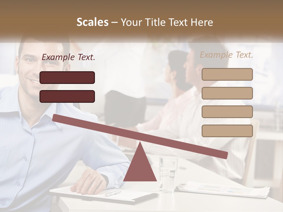 A Man Sitting At A Desk In Front Of A Group Of People PowerPoint Template