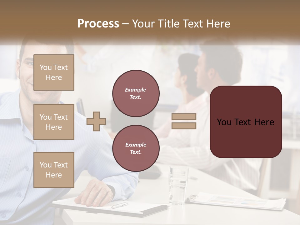 A Man Sitting At A Desk In Front Of A Group Of People PowerPoint Template