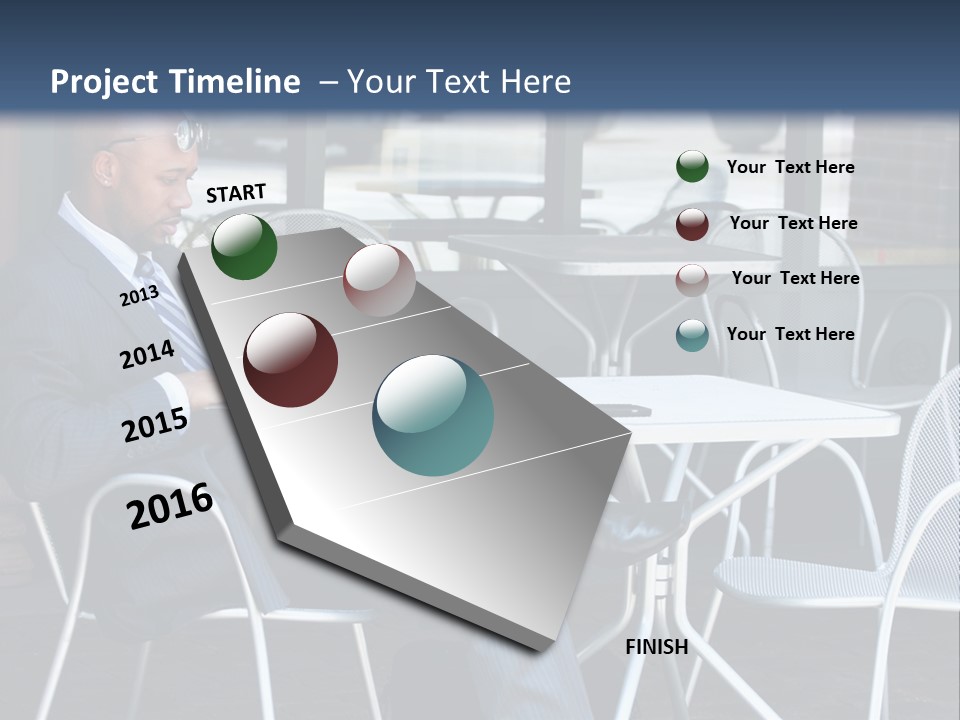 A Man In A Suit Sitting At A Table With A Laptop PowerPoint Template