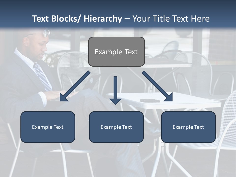A Man In A Suit Sitting At A Table With A Laptop PowerPoint Template