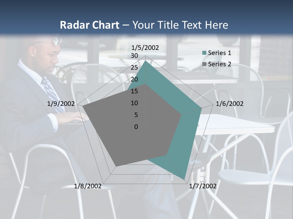 A Man In A Suit Sitting At A Table With A Laptop PowerPoint Template