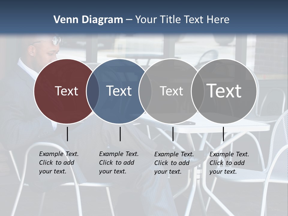 A Man In A Suit Sitting At A Table With A Laptop PowerPoint Template