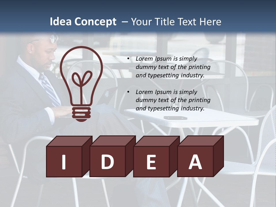 A Man In A Suit Sitting At A Table With A Laptop PowerPoint Template