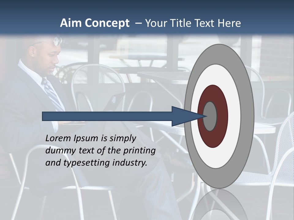 A Man In A Suit Sitting At A Table With A Laptop PowerPoint Template