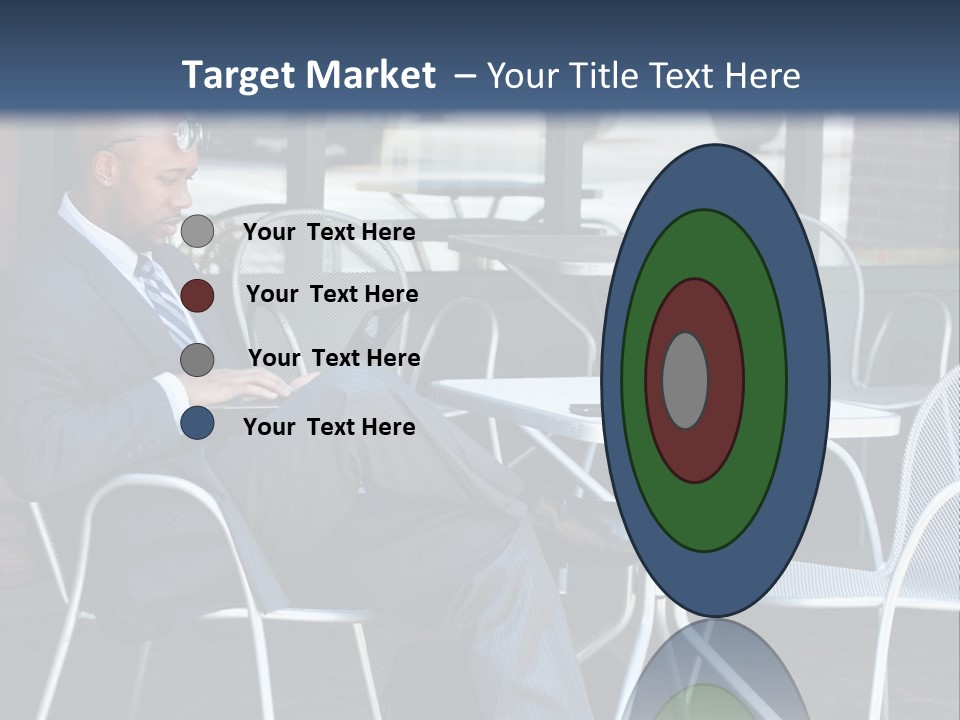 A Man In A Suit Sitting At A Table With A Laptop PowerPoint Template