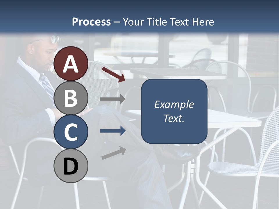 A Man In A Suit Sitting At A Table With A Laptop PowerPoint Template