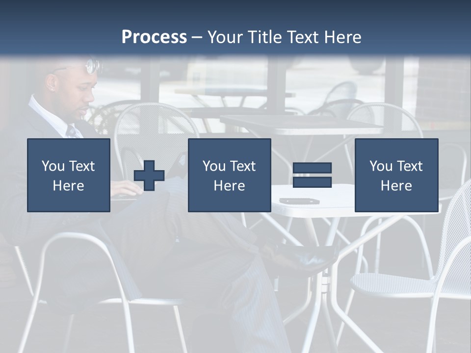 A Man In A Suit Sitting At A Table With A Laptop PowerPoint Template