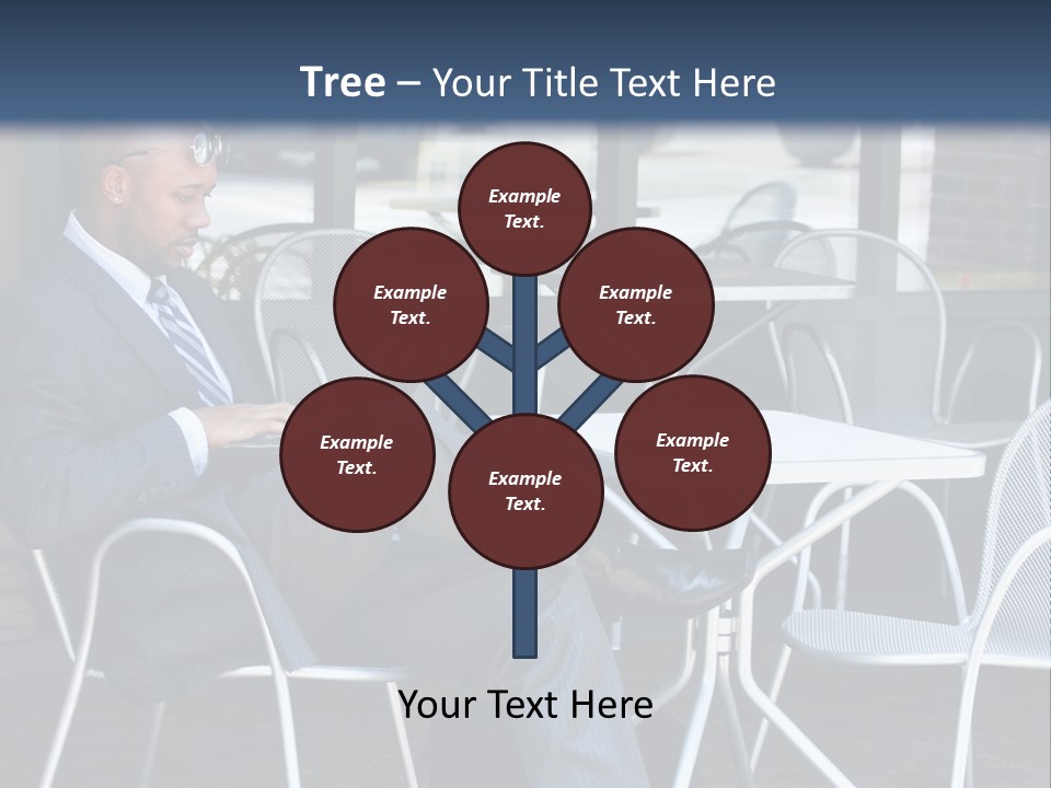 A Man In A Suit Sitting At A Table With A Laptop PowerPoint Template