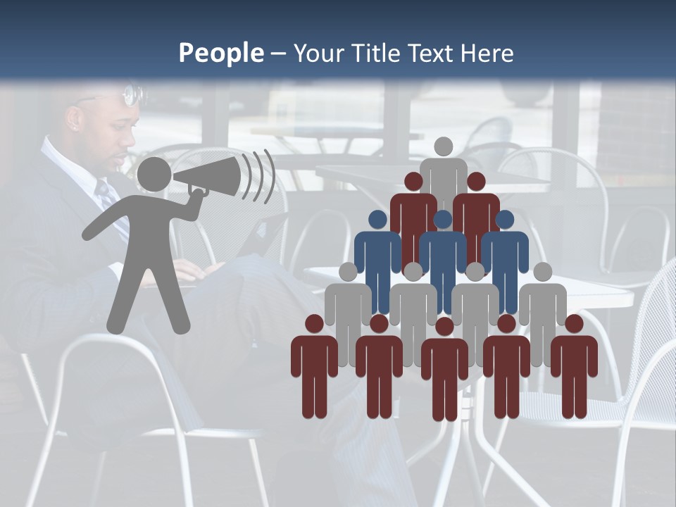 A Man In A Suit Sitting At A Table With A Laptop PowerPoint Template