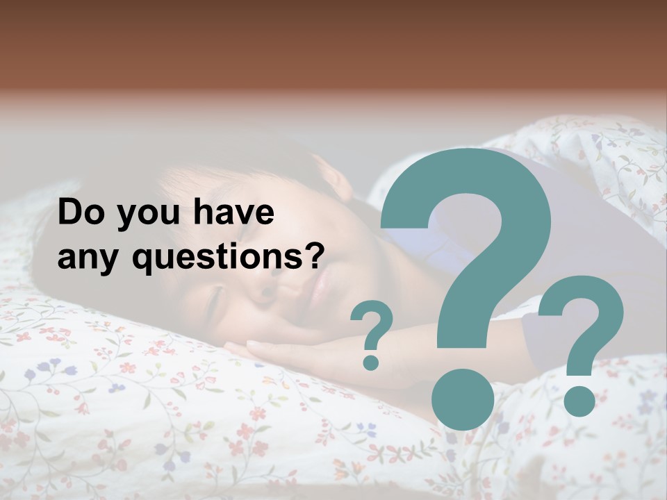 A Young Boy Sleeping On A Bed With A Pillow PowerPoint Template