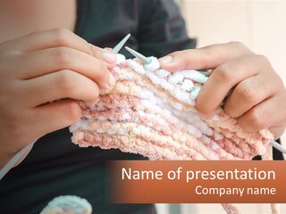 A Person Is Knitting A Piece Of Yarn PowerPoint Template