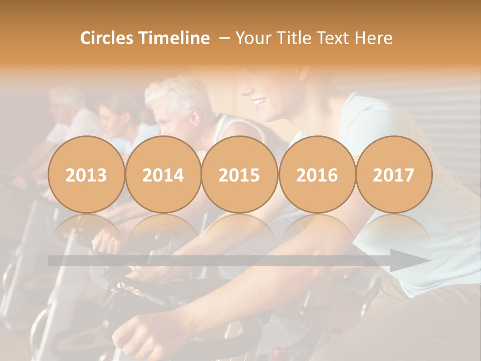 A Group Of People Riding Stationary Bikes In A Gym PowerPoint Template