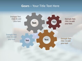 A Person Holding A Small Device In Their Hands PowerPoint Template