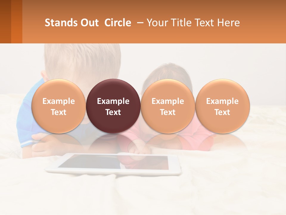 Two Children Laying On A Bed Playing With A Tablet PowerPoint Template