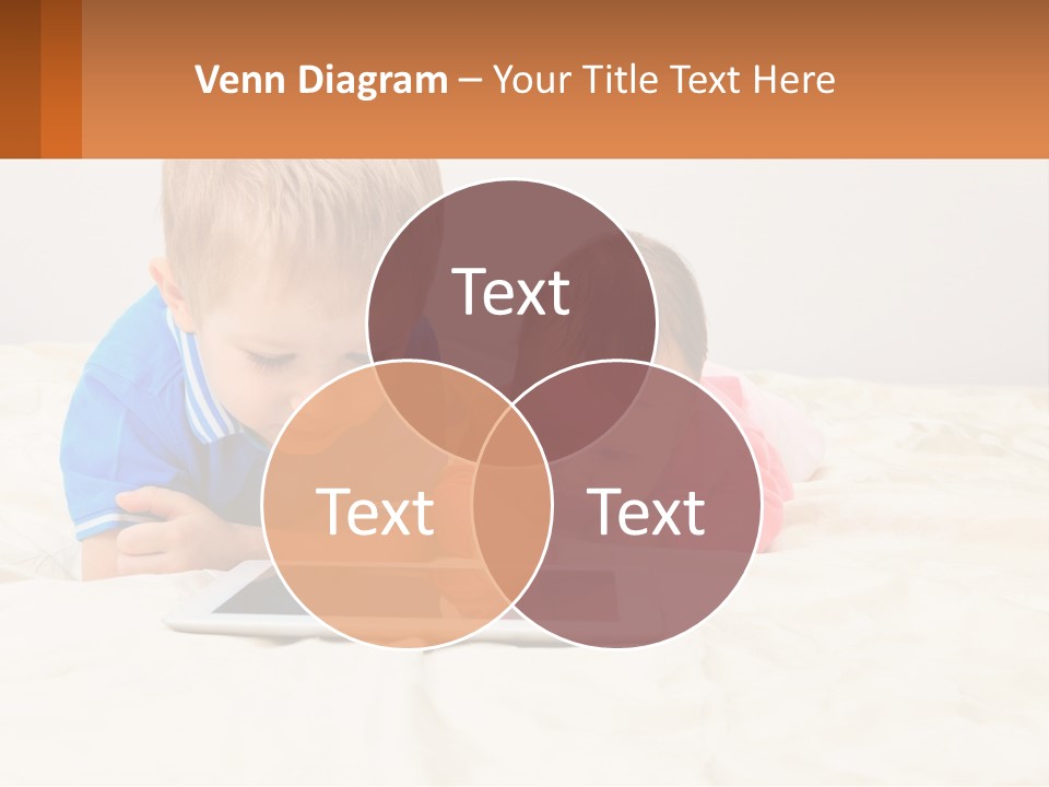 Two Children Laying On A Bed Playing With A Tablet PowerPoint Template