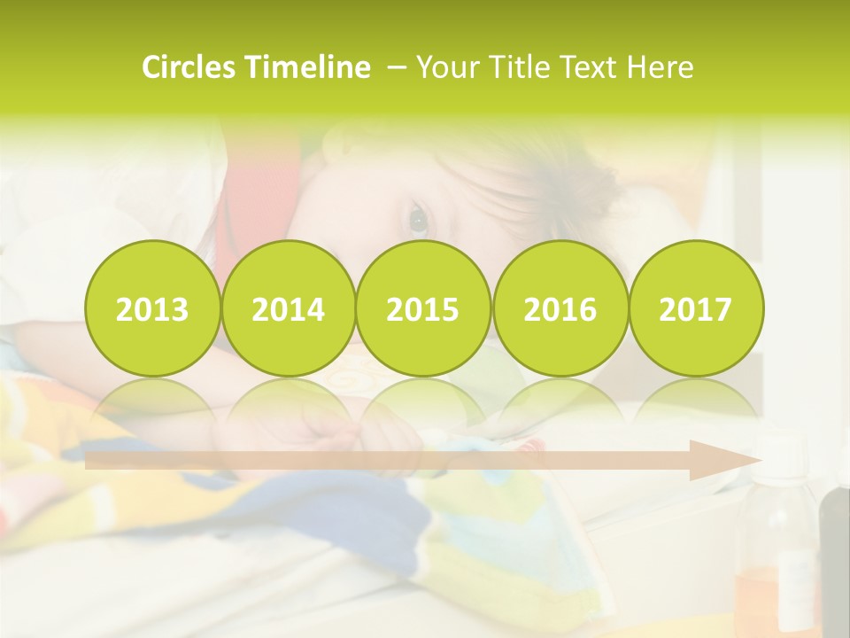 A Child Laying On A Bed With A Blanket PowerPoint Template