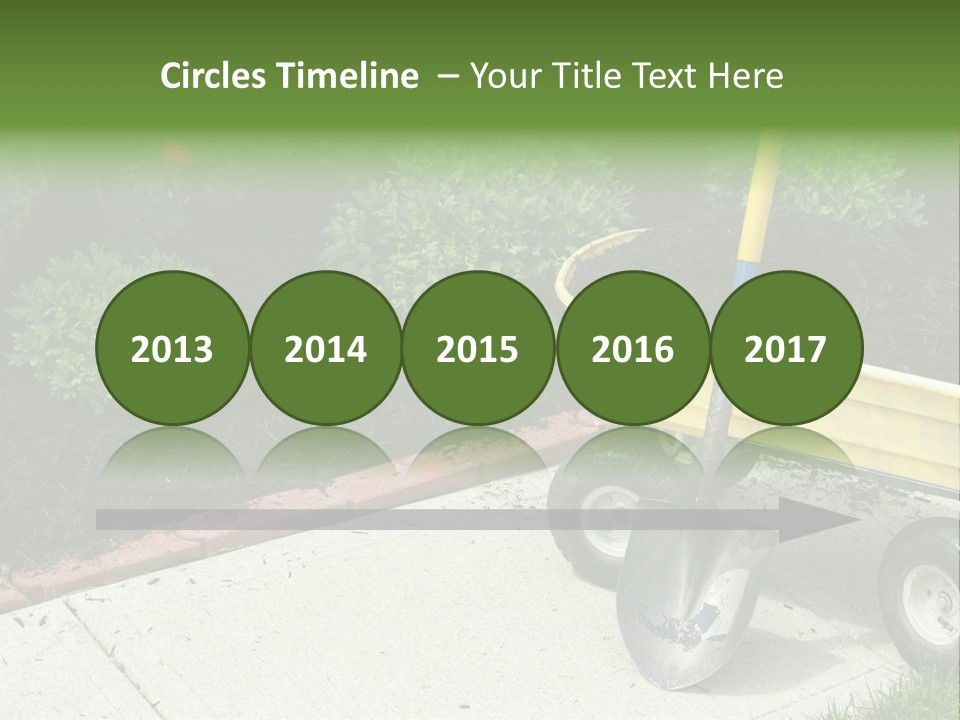 A Yellow Wheelbarrow With A Shovel On A Sidewalk PowerPoint Template