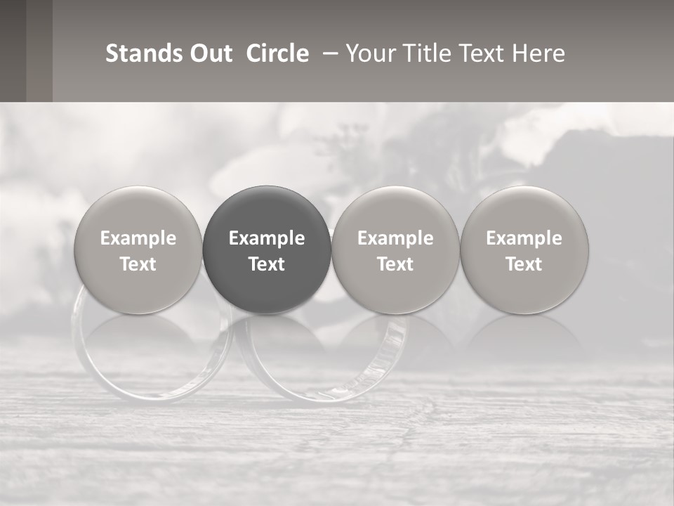 Two Wedding Rings Sitting On Top Of A Wooden Table PowerPoint Template