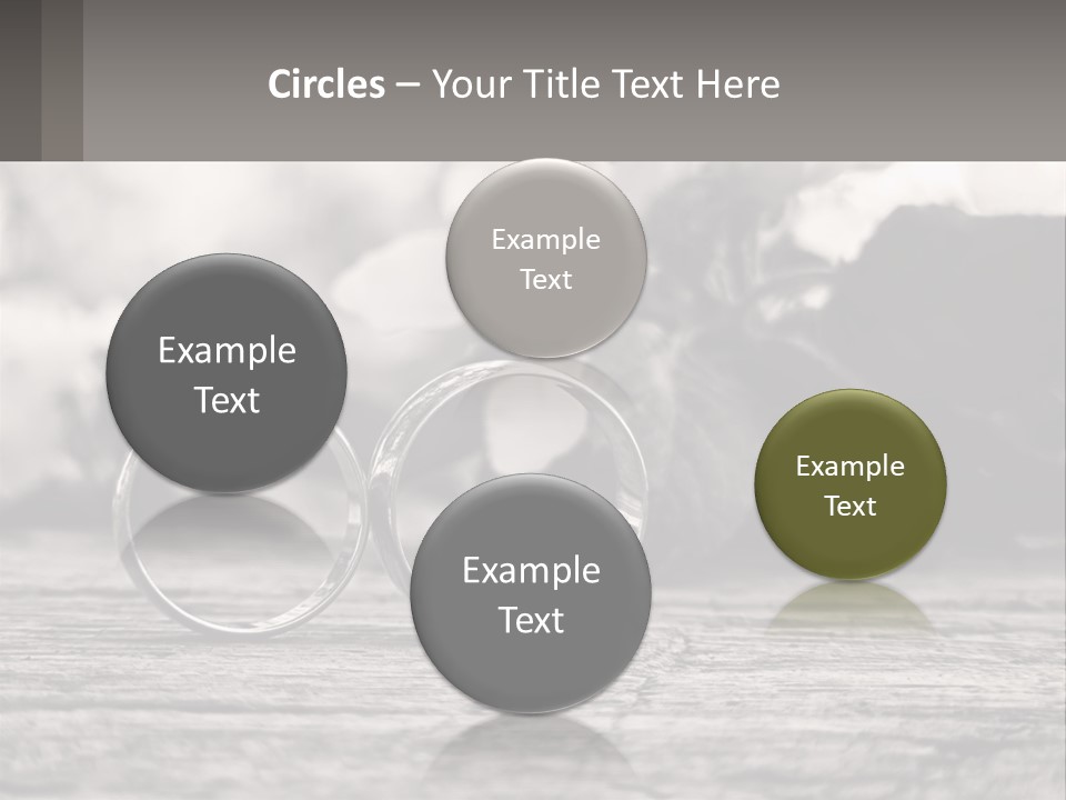 Two Wedding Rings Sitting On Top Of A Wooden Table PowerPoint Template