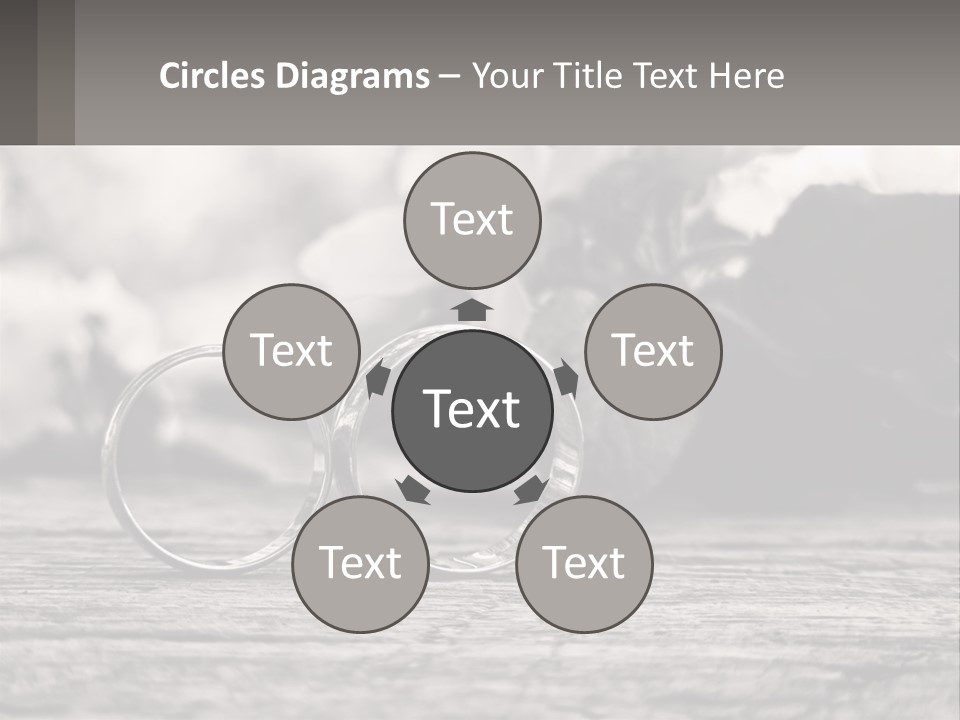 Two Wedding Rings Sitting On Top Of A Wooden Table PowerPoint Template