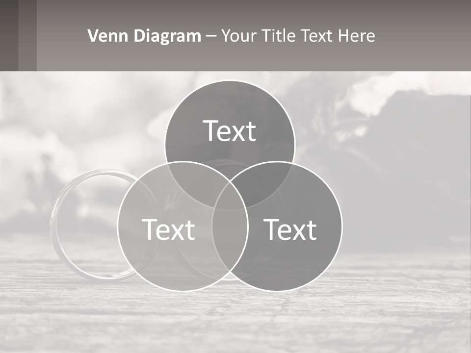 Two Wedding Rings Sitting On Top Of A Wooden Table PowerPoint Template