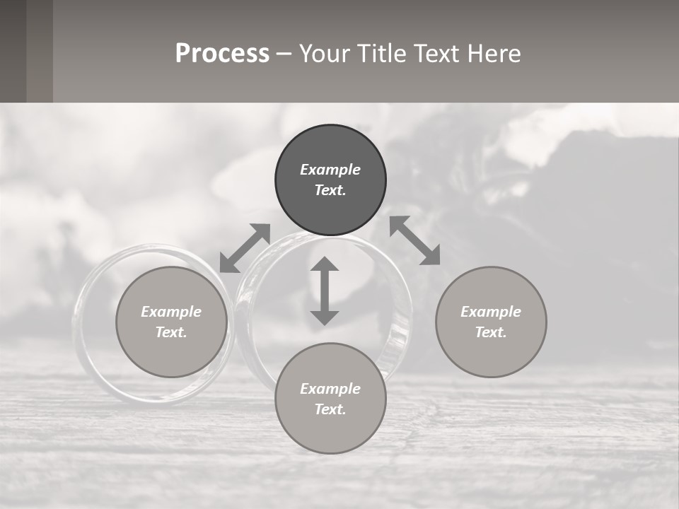 Two Wedding Rings Sitting On Top Of A Wooden Table PowerPoint Template