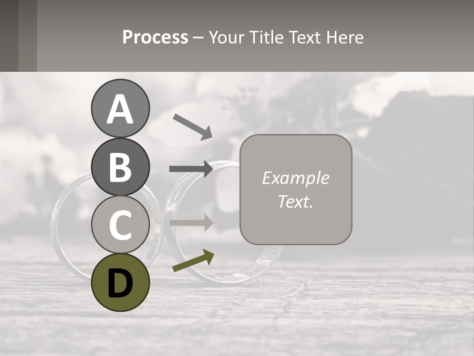 Two Wedding Rings Sitting On Top Of A Wooden Table PowerPoint Template
